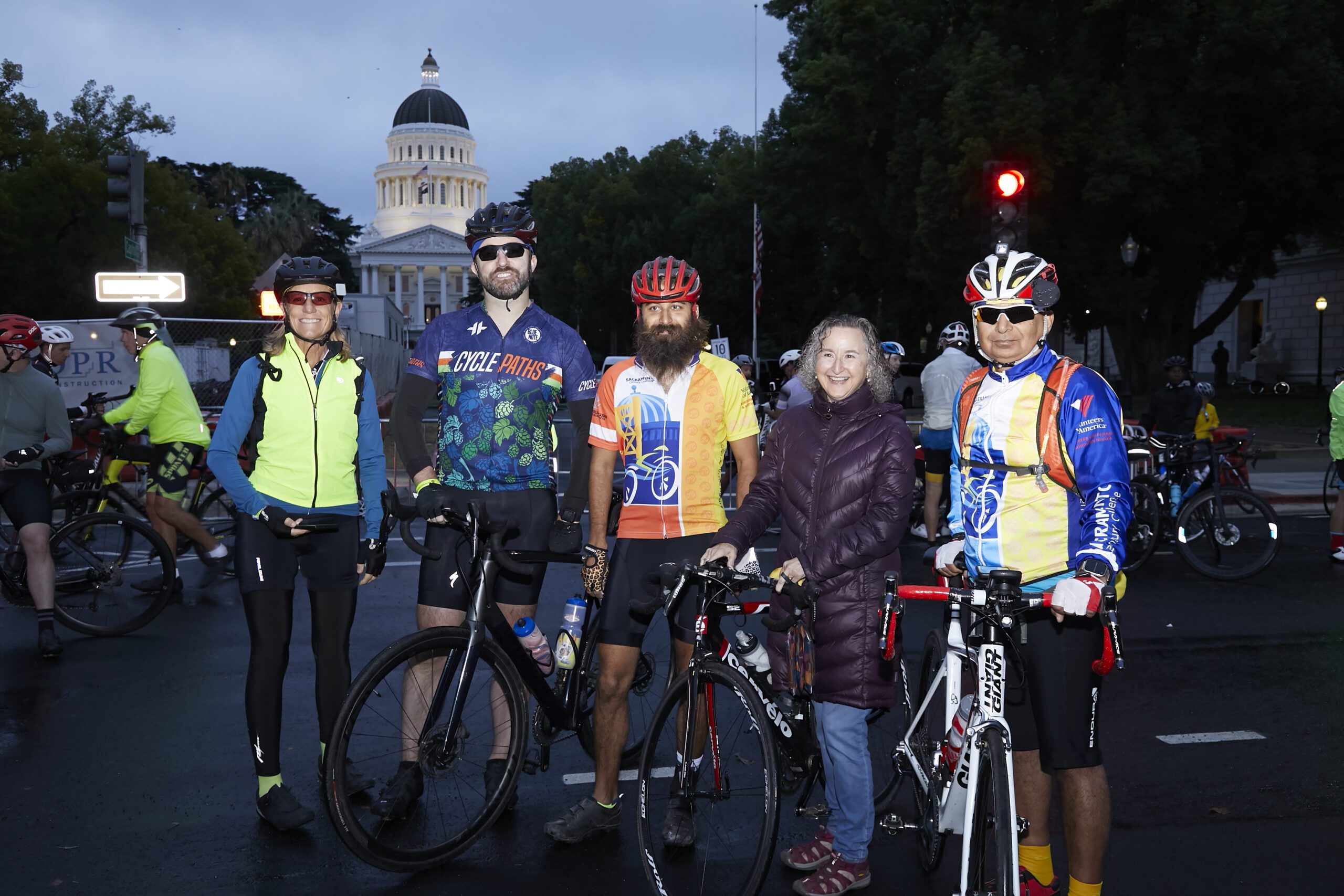 Group of riders standing in front of Capitol building