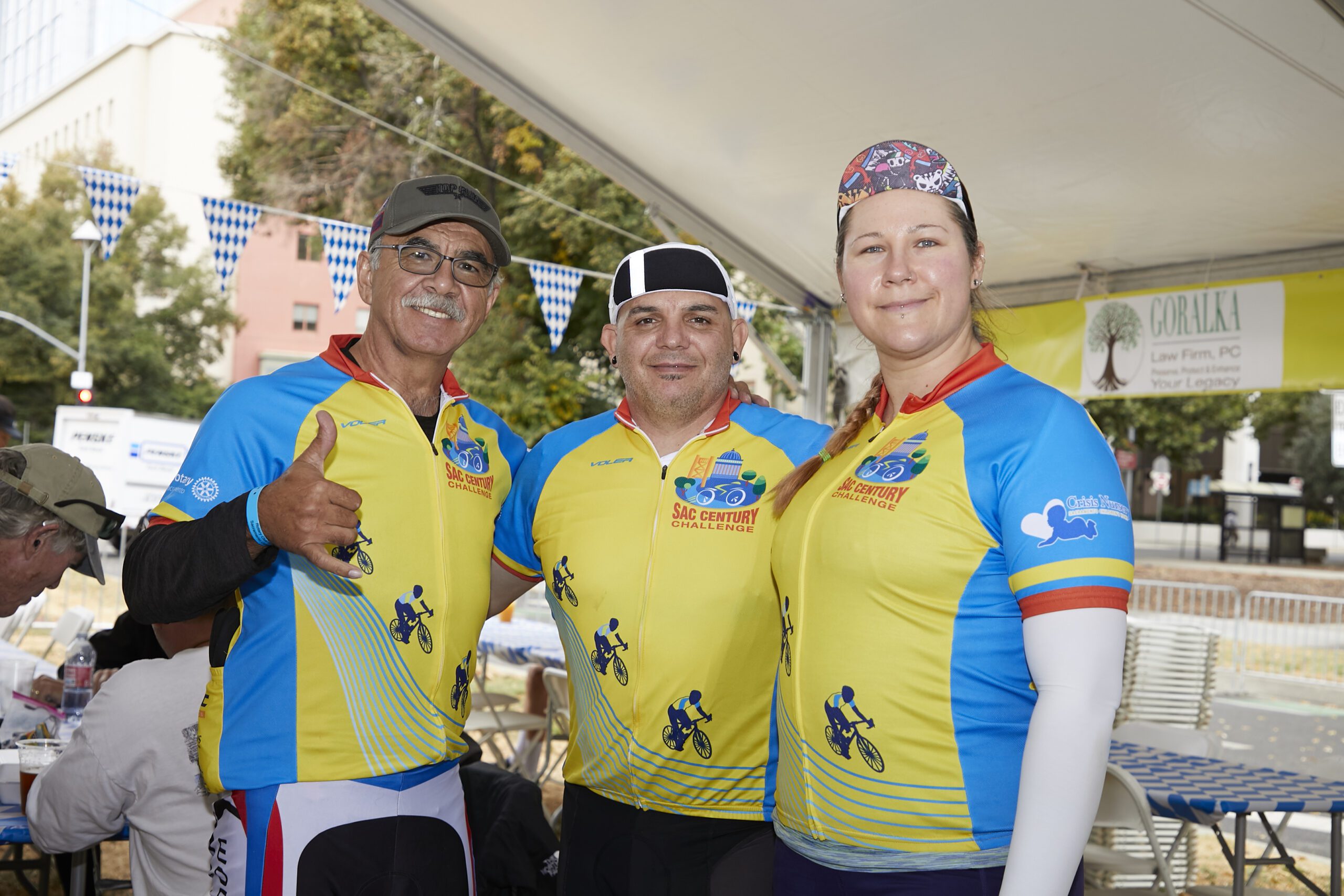 Three riders posing for camera