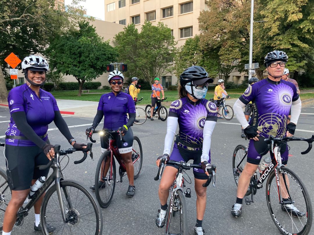 Group of riders in purple jerseys